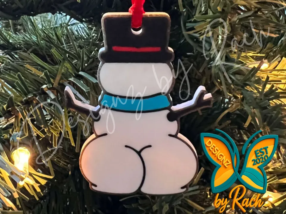 Cheeky snowman ornament with a top hat hanging on a tree