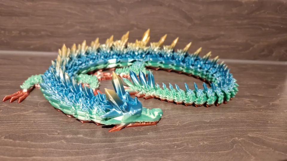 Teal and gold articulated crystal dragon