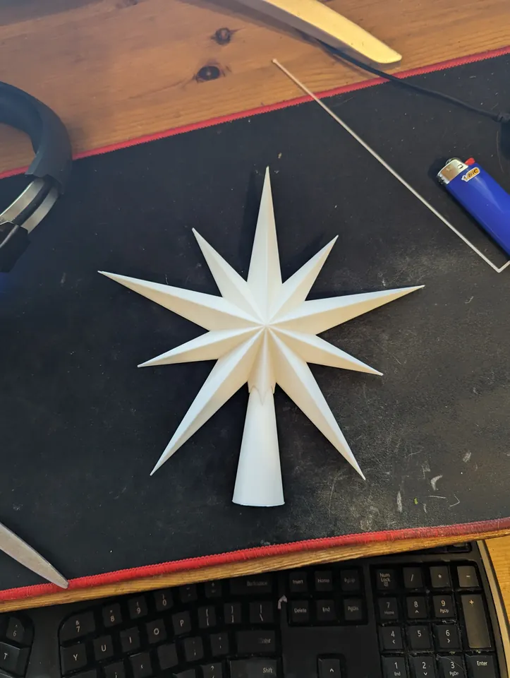 White many-pointed star tree topper
